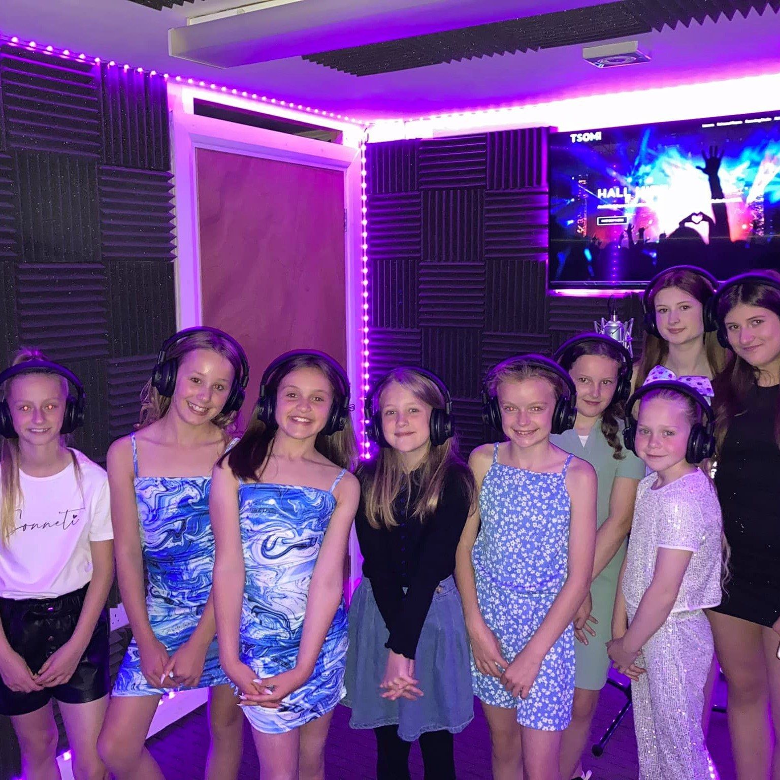 A group of children at a pop star party in the recording studio